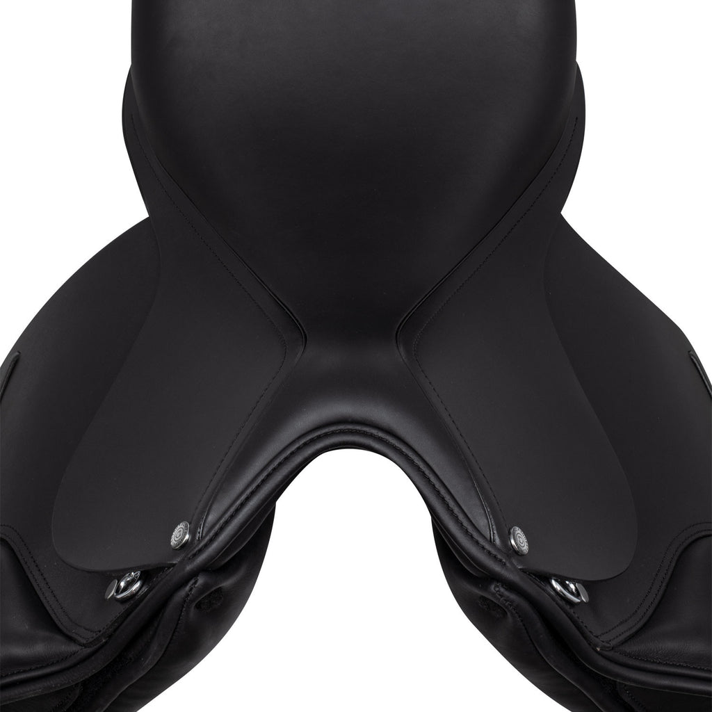 Dressage saddle with removable blocks