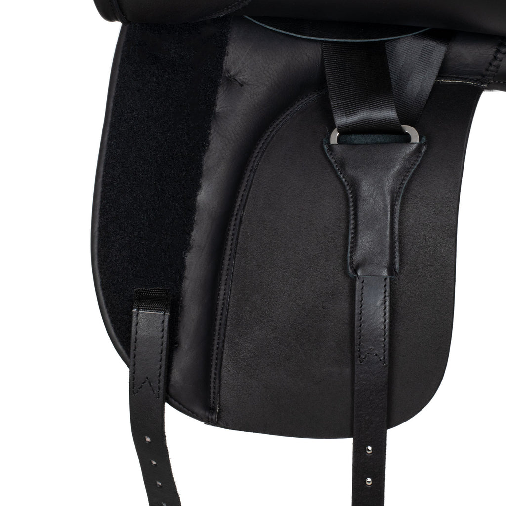 Dressage saddle with removable blocks